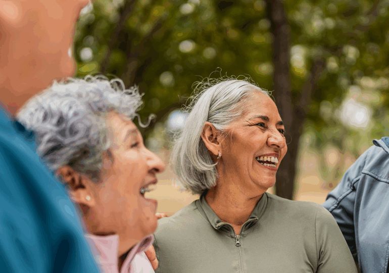 Group of elderly people smiling and laughing